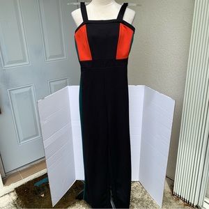 CHARLOTTE RUSSE. Black/Red/Teal block printed jumpsuit.Sleeveless.Zipper…